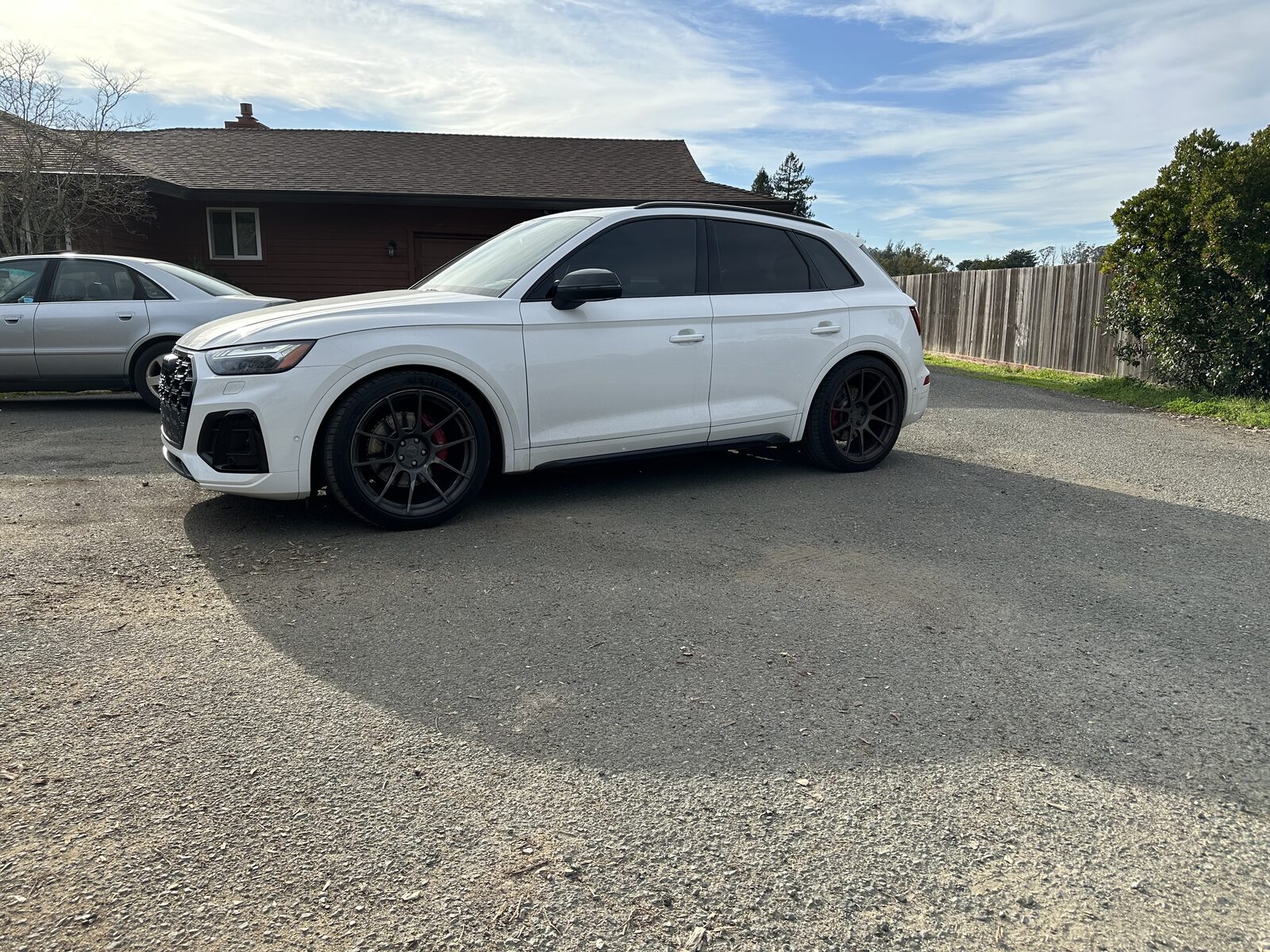 Modified white Audi SQ5 with black performance wheels — serviced at N8's Place